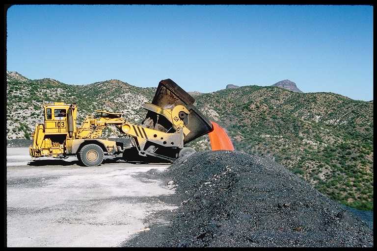 Smelter slag being dumped.  This operation was orginally performed by rail cars.  Now done using these custom vehicles.
